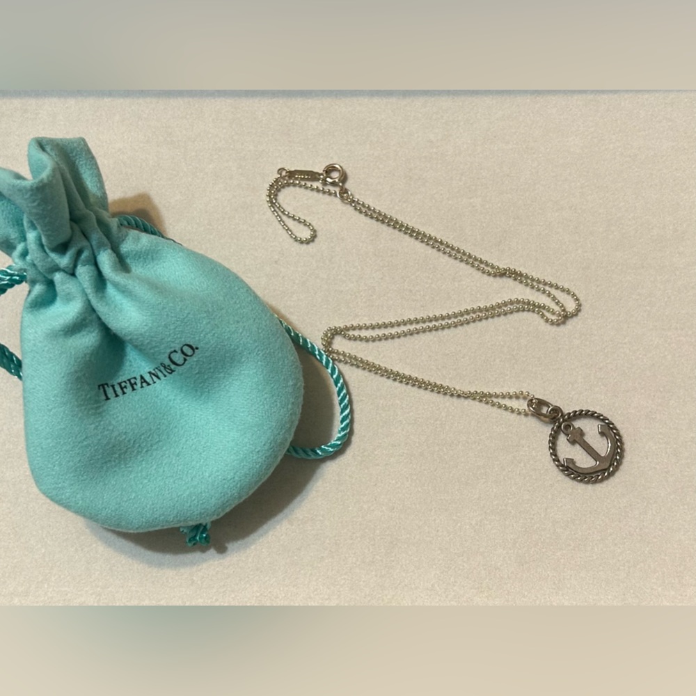 Tiffany & Co. Anchor pendant and silver chain.